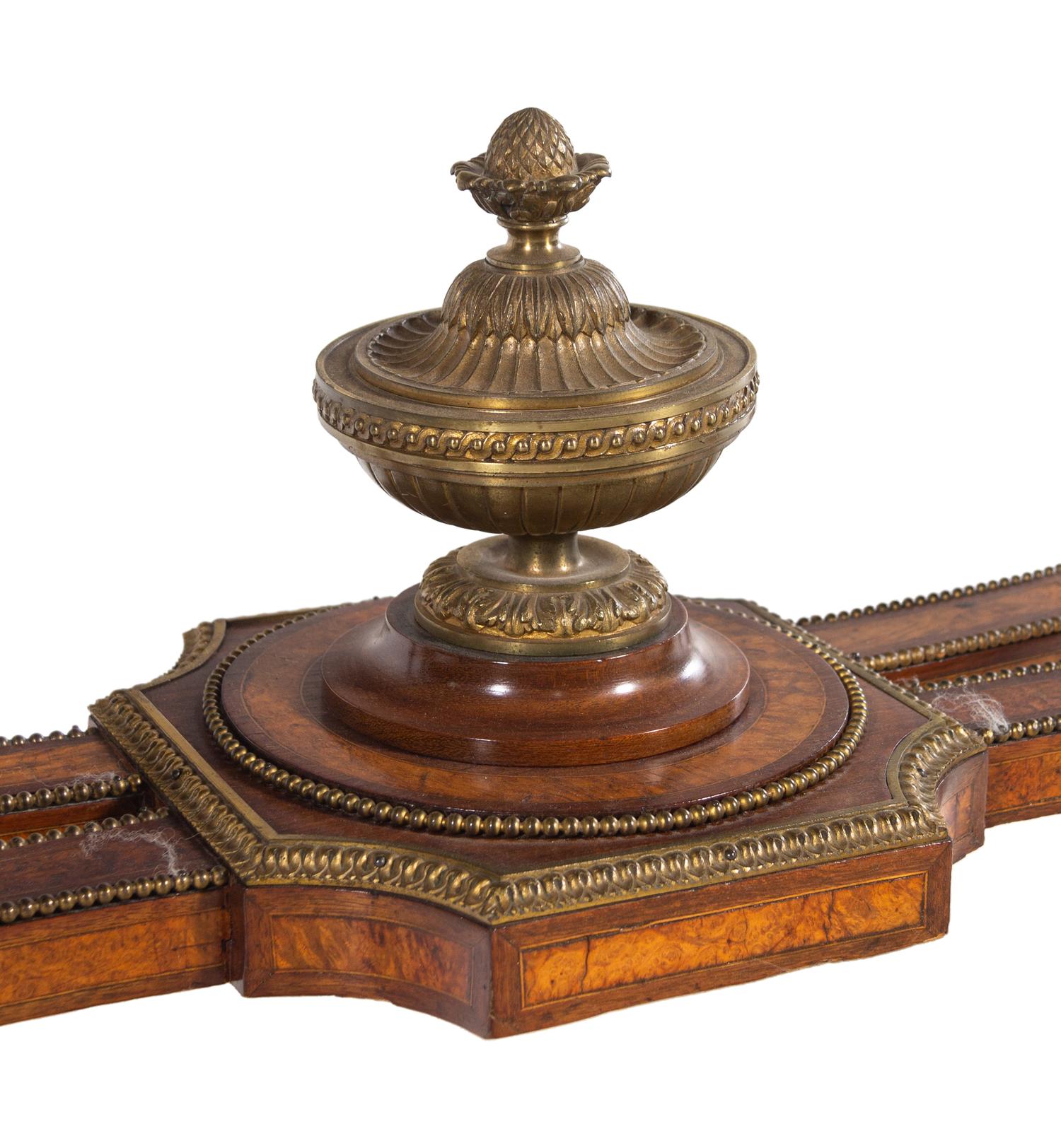 A Napoleon III Velvet-Inset and Gilt Bronze Mounted Amboyna Center Table