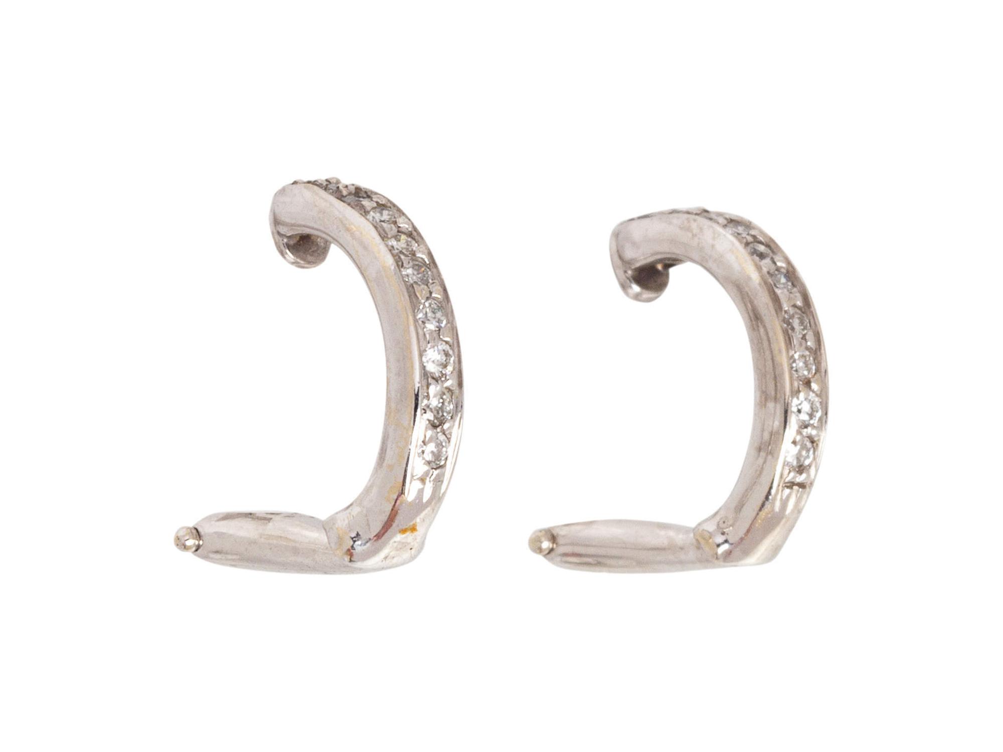 A Pair of White Gold and Diamond Earclips,