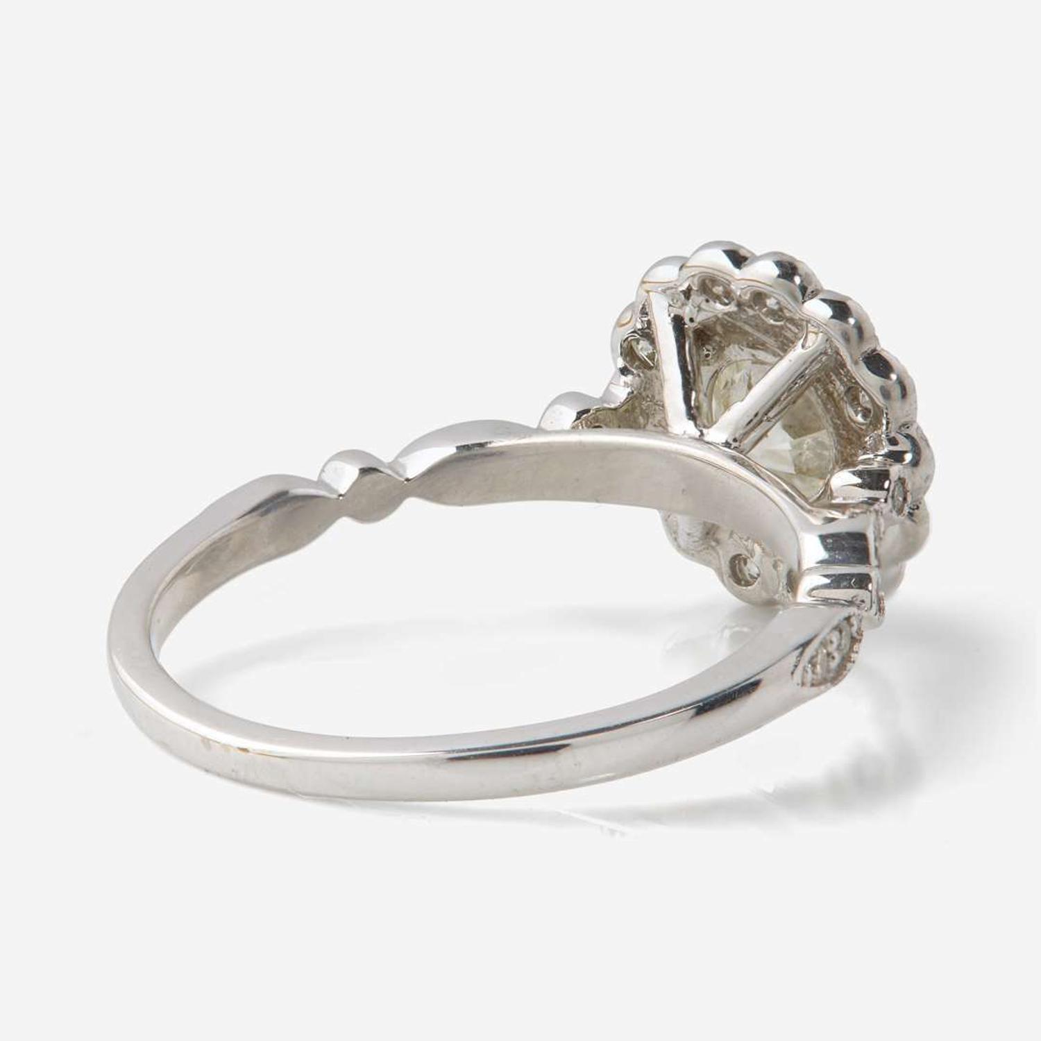 An 18K White Gold and Diamond Ring