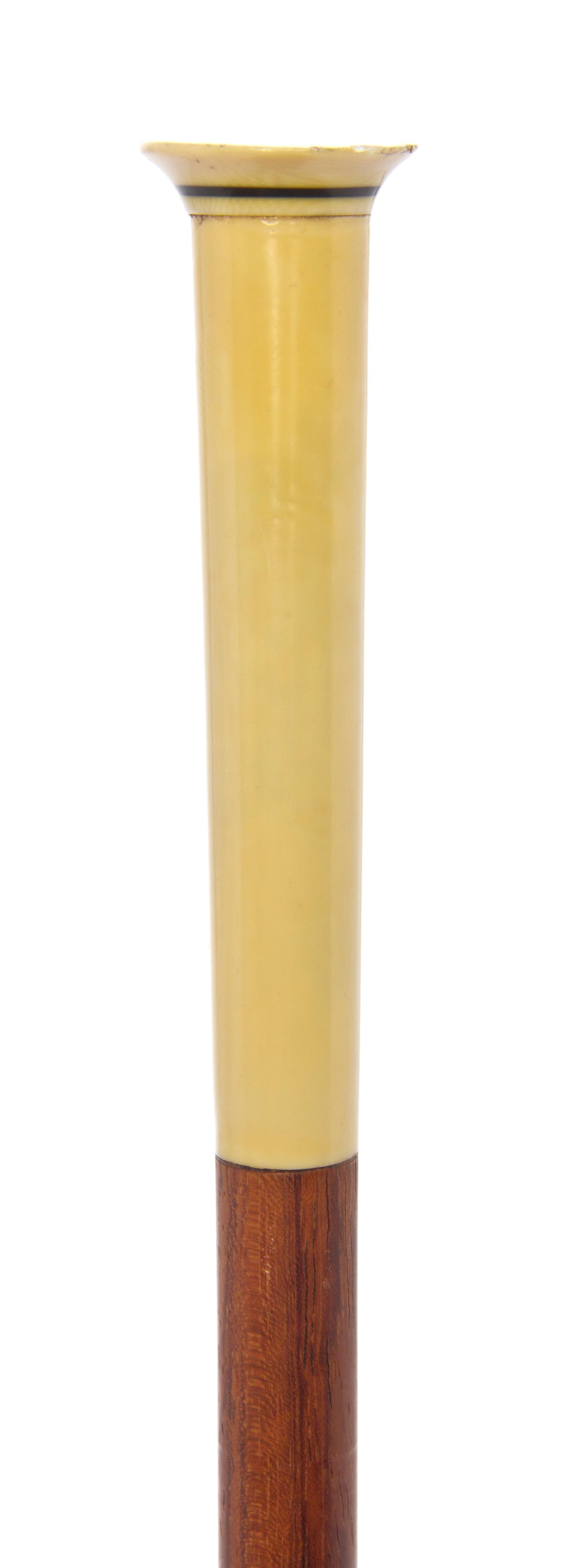 A French Art Deco Ivory Handled Walking Stick, Length of handle 4 1/2 x length overall 36 inches.