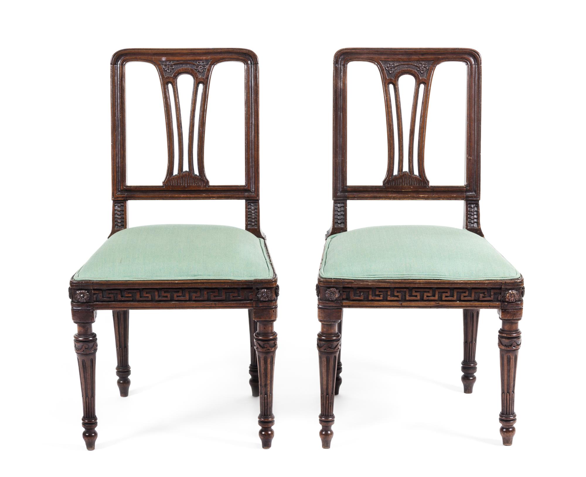 A Pair of Neoclassical Walnut Side Chairs Height 36 3/4 inches.