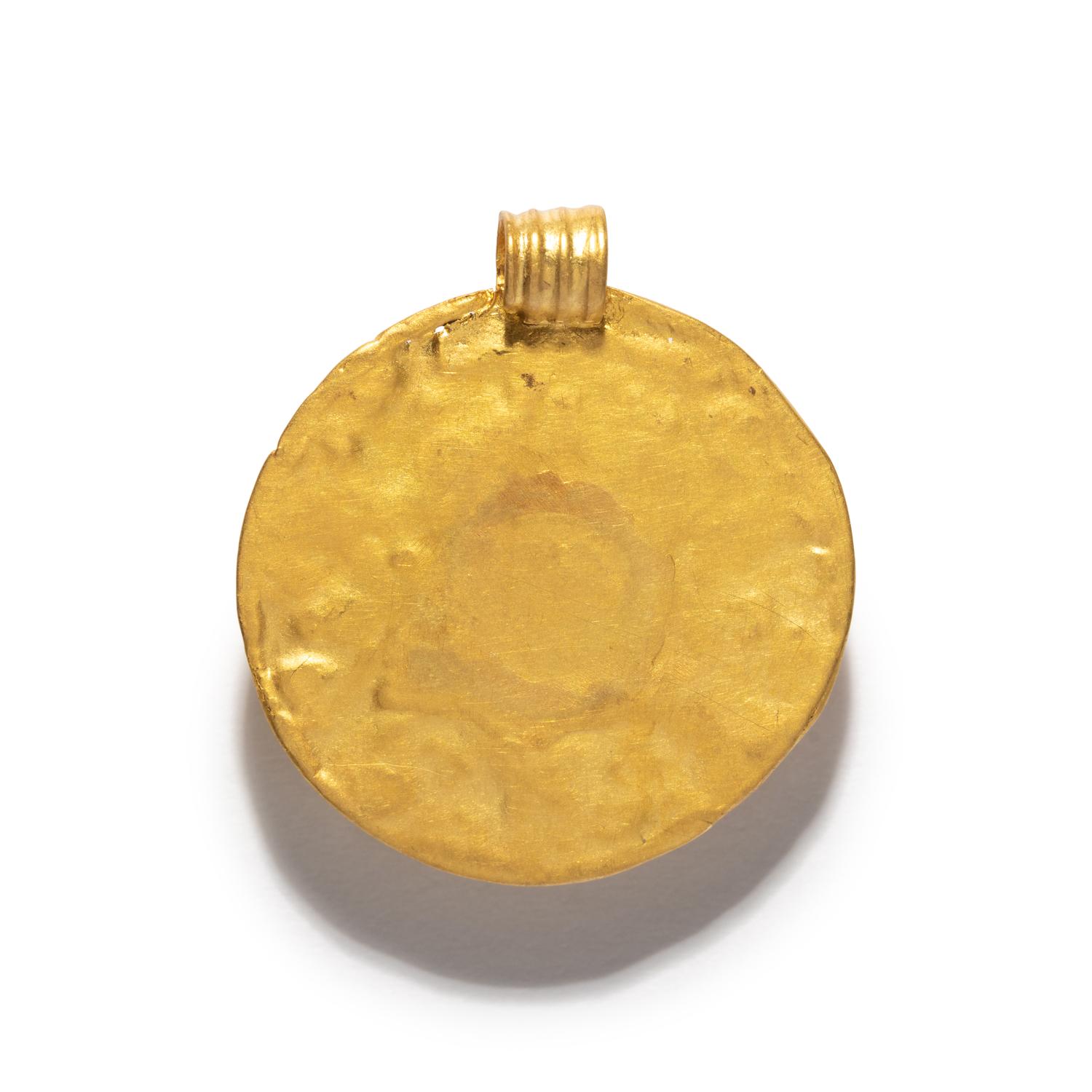 A Roman Gold Pendant with a Garnet Cabochon