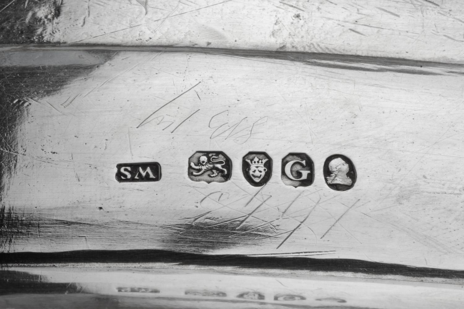A George III Silver Tray, William Stroud, London, 1802, of oval form with a gadroon rim, the border with engraved crests.