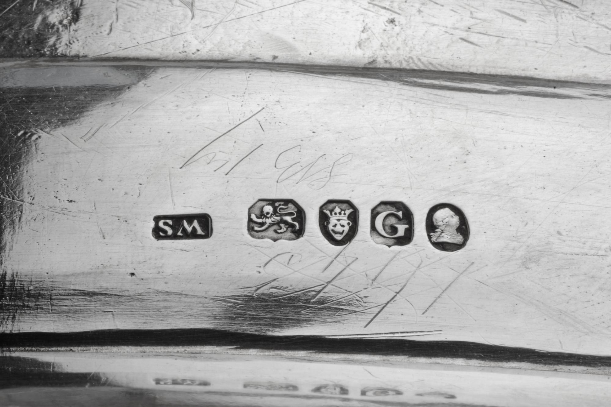 A George III Silver Tray, William Stroud, London, 1802, of oval form with a gadroon rim, the border with engraved crests.