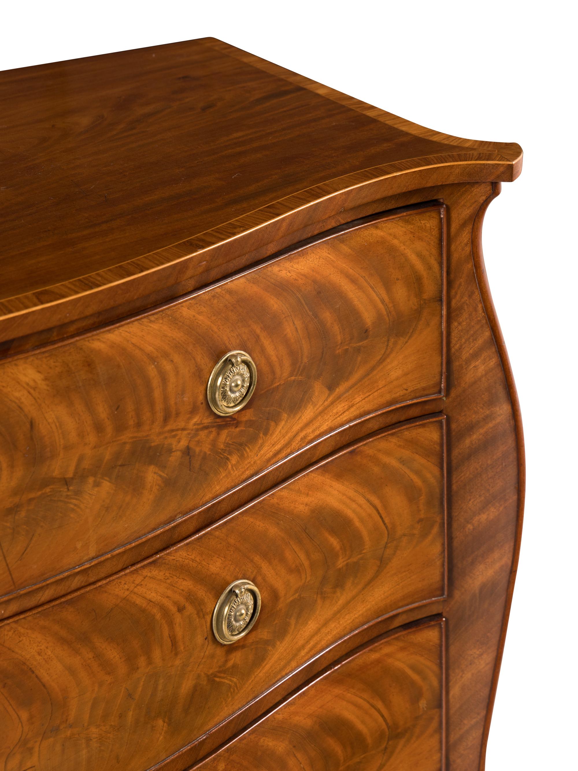 A George III Mahogany Serpentine Commode