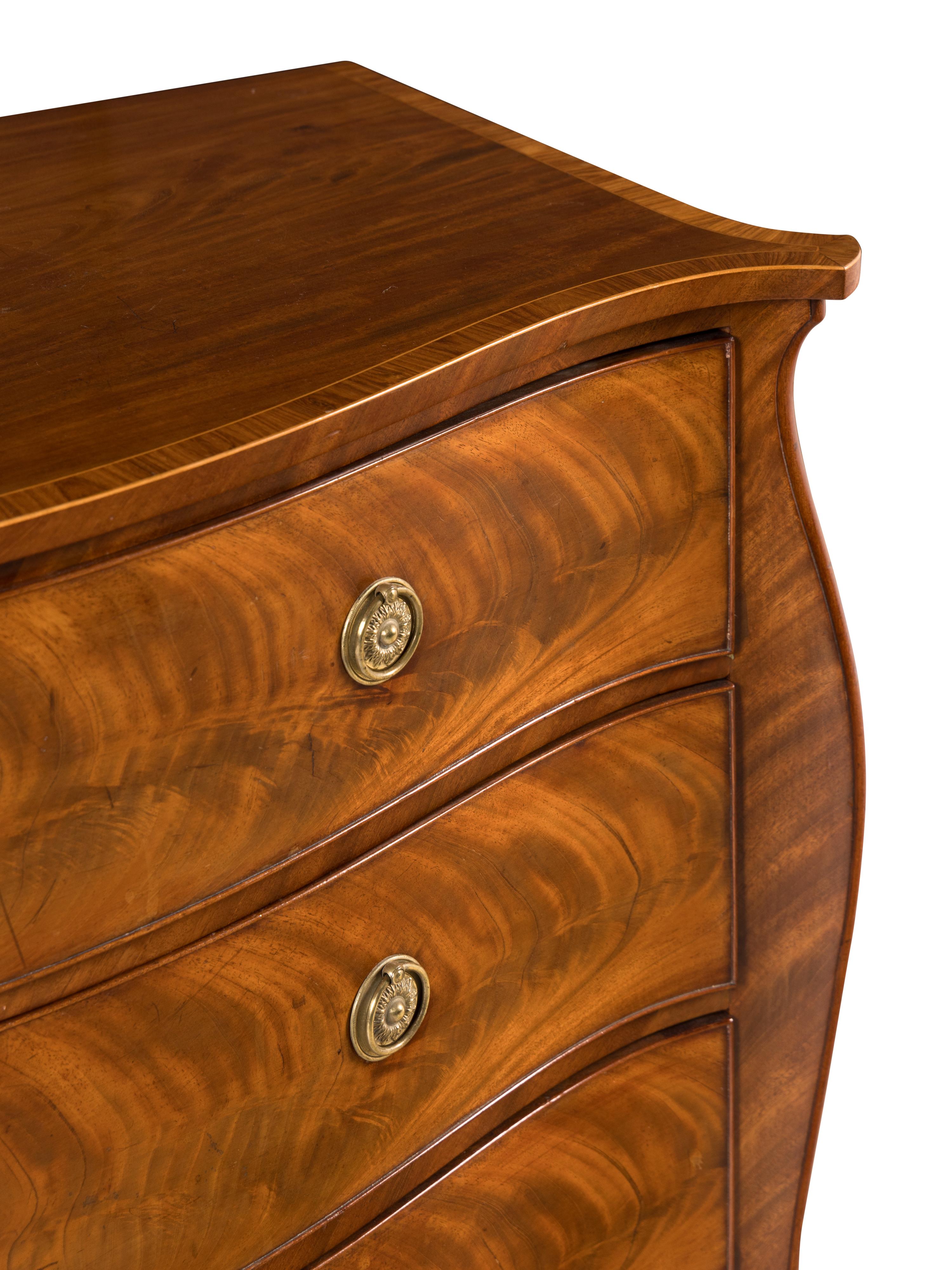 A George III Mahogany Serpentine Commode