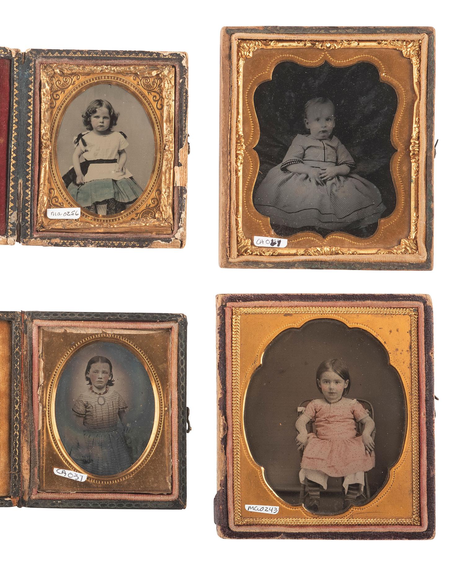 [EARLY PHOTOGRAPHY]. 18 ambrotypes and tintypes of children, many featuring fine hand tinting.