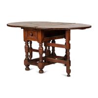 A Swedish Turned and Block Carved Pine Drop-Leaf Gate-Leg Dining Table