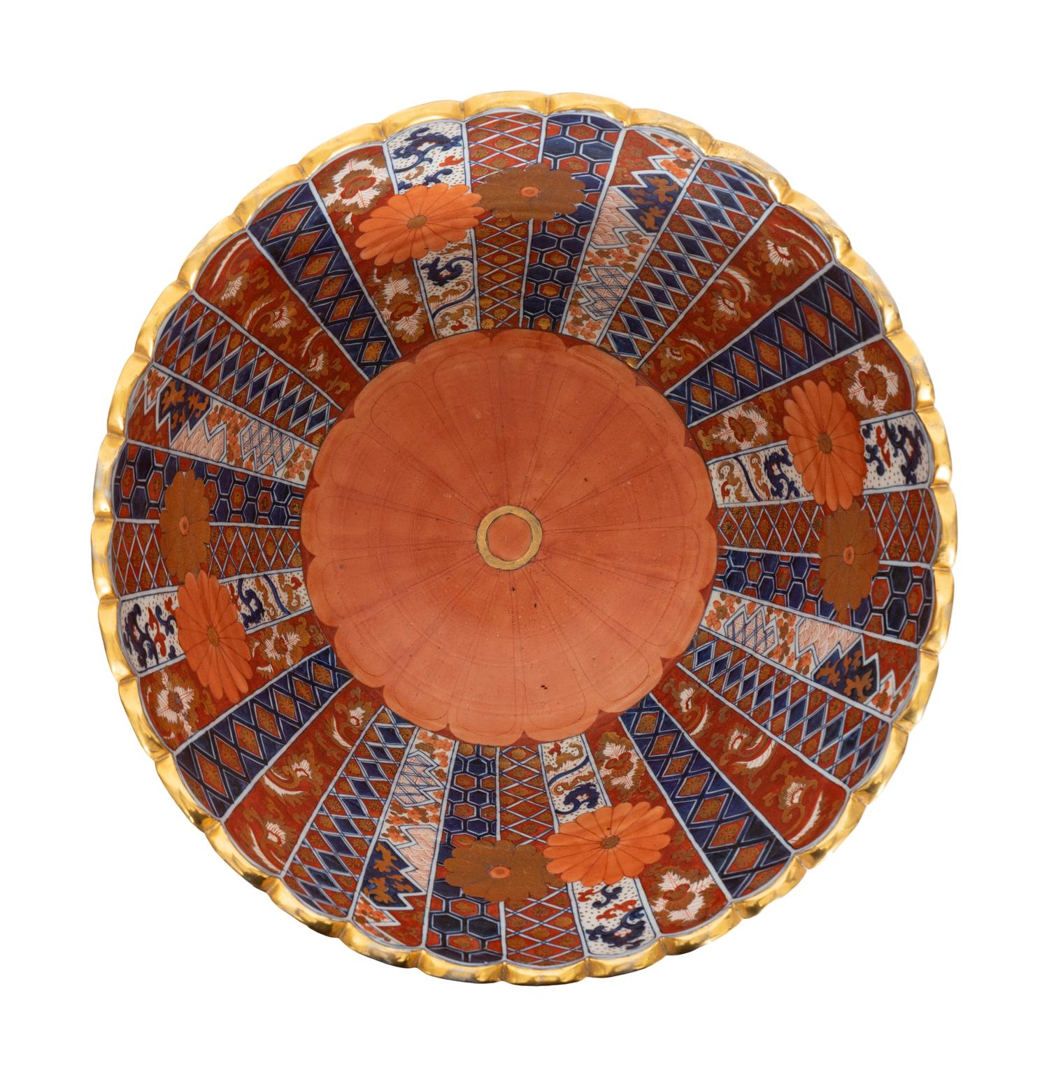 An Associated Pair of Large Japanese Imari Porcelain Punch Bowls