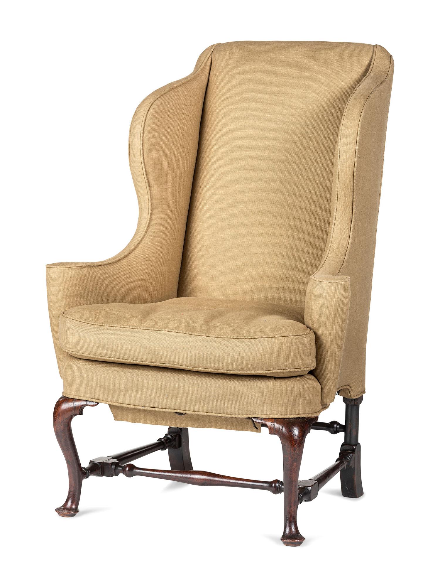 A Queen Anne Turned and Carved Walnut Stretcher Base and Pad Foot Easy Chair