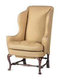 A Queen Anne Turned and Carved Walnut Stretcher Base and Pad Foot Easy Chair