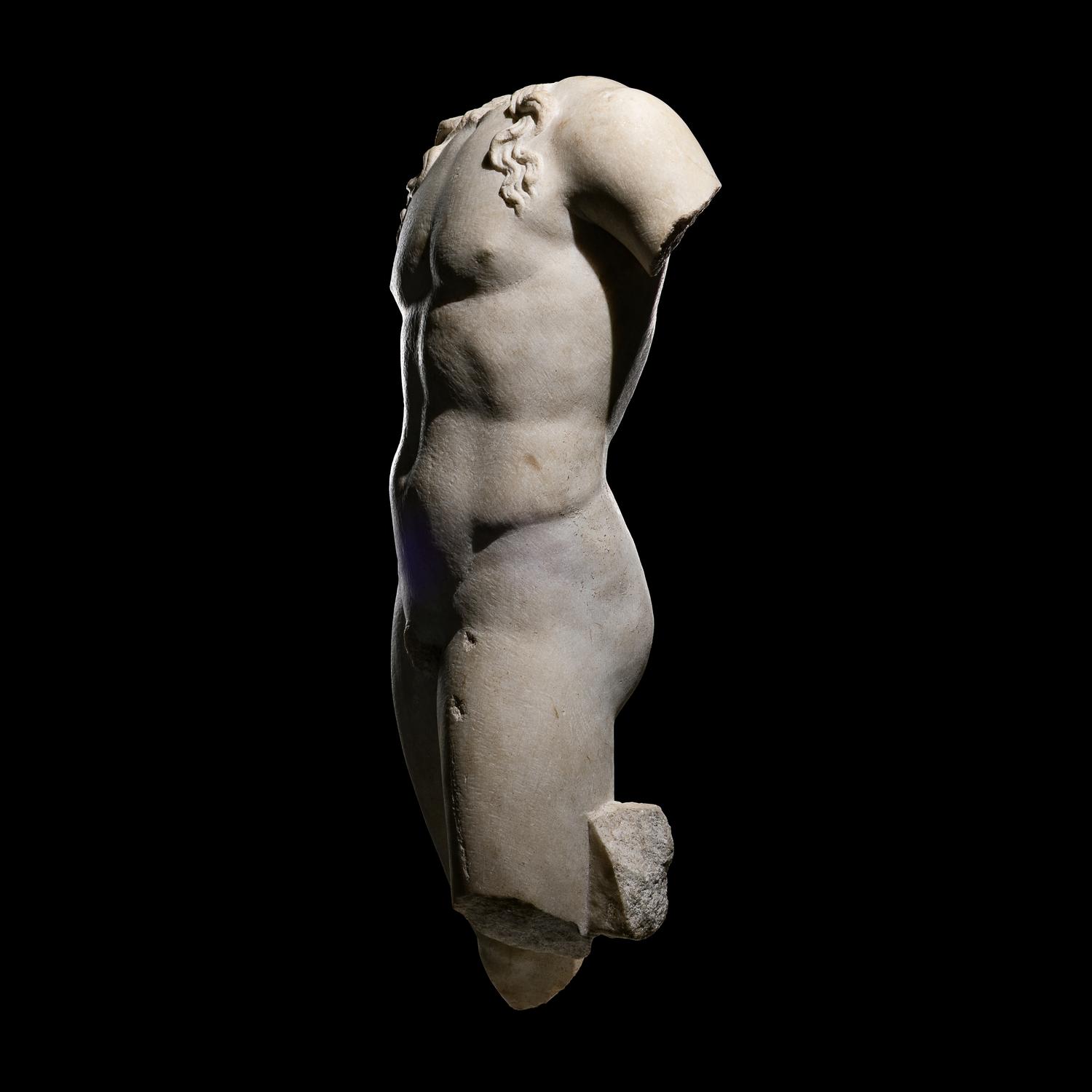 A Roman Marble Torso of a Youthful God