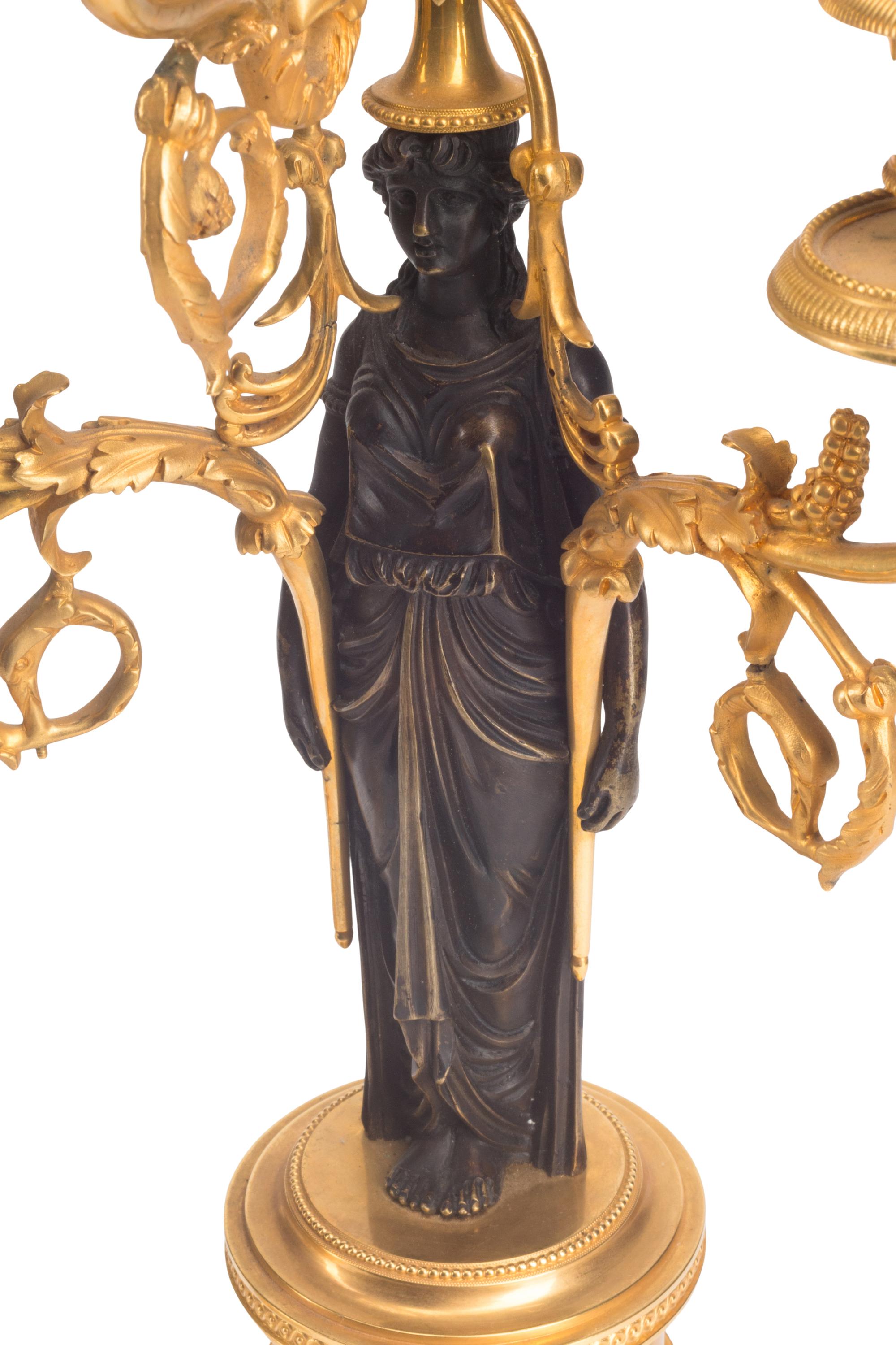 An Empire Gilt and Patinated Bronze Clock Garniture