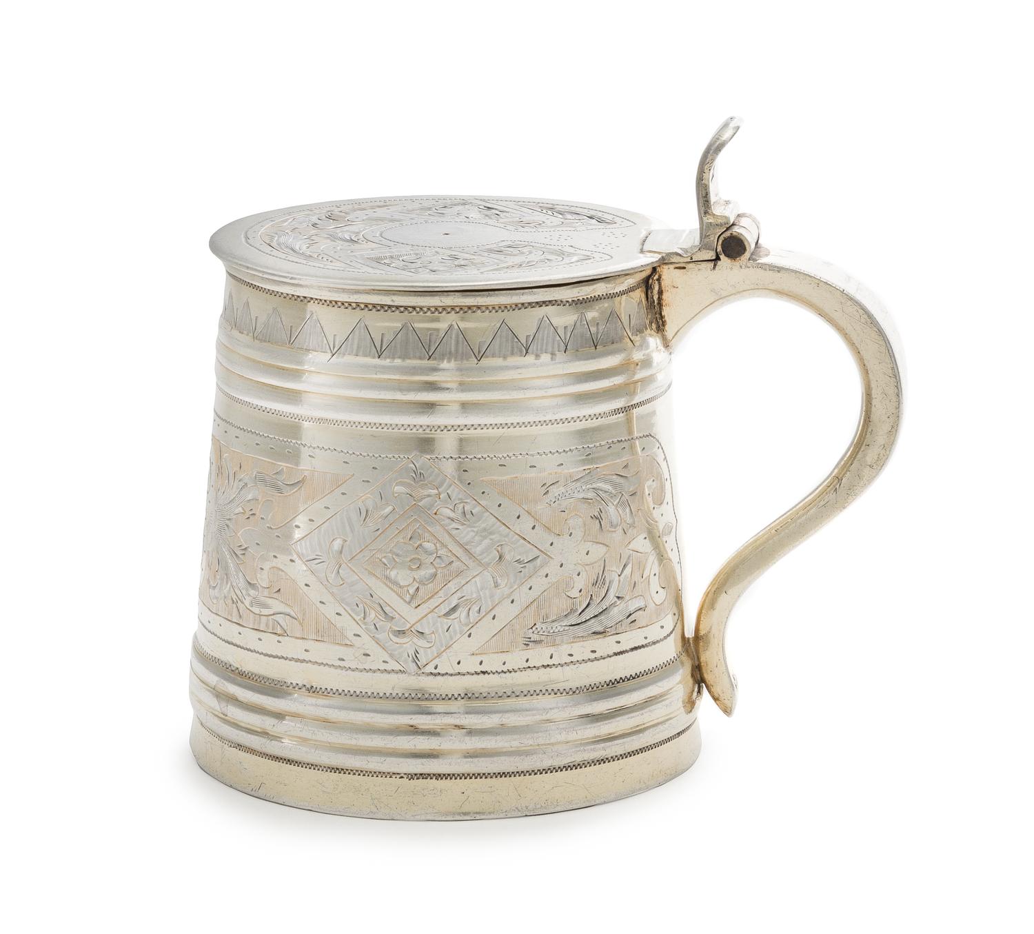 A Russian Silver Child's Tankard, Maker's Mark Cyrillic H.A, Moscow, 1869, the lid and body chased with floral and foliate volute bandi