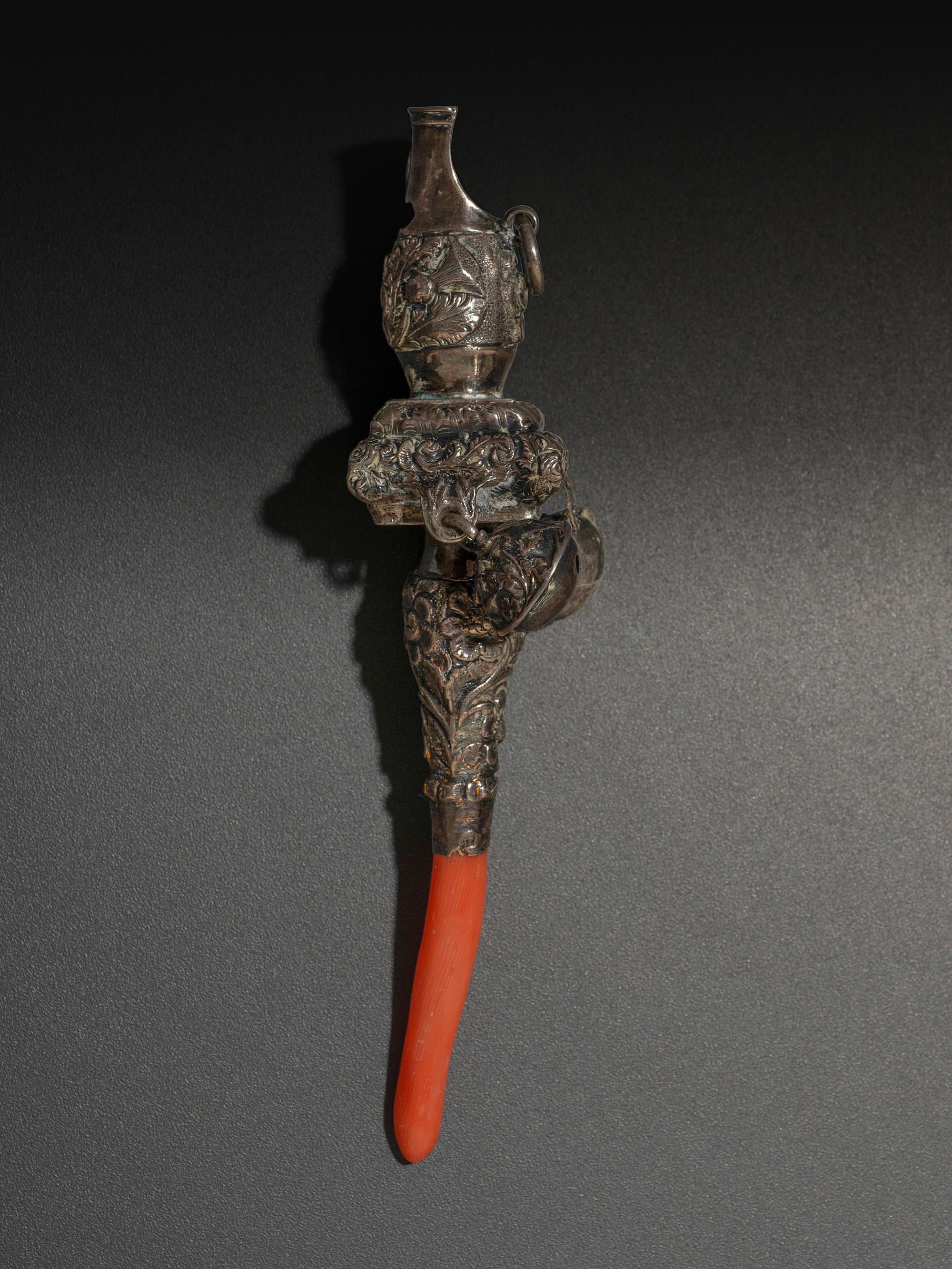 A Silver and Coral Mounted Child's Rattle Whistle