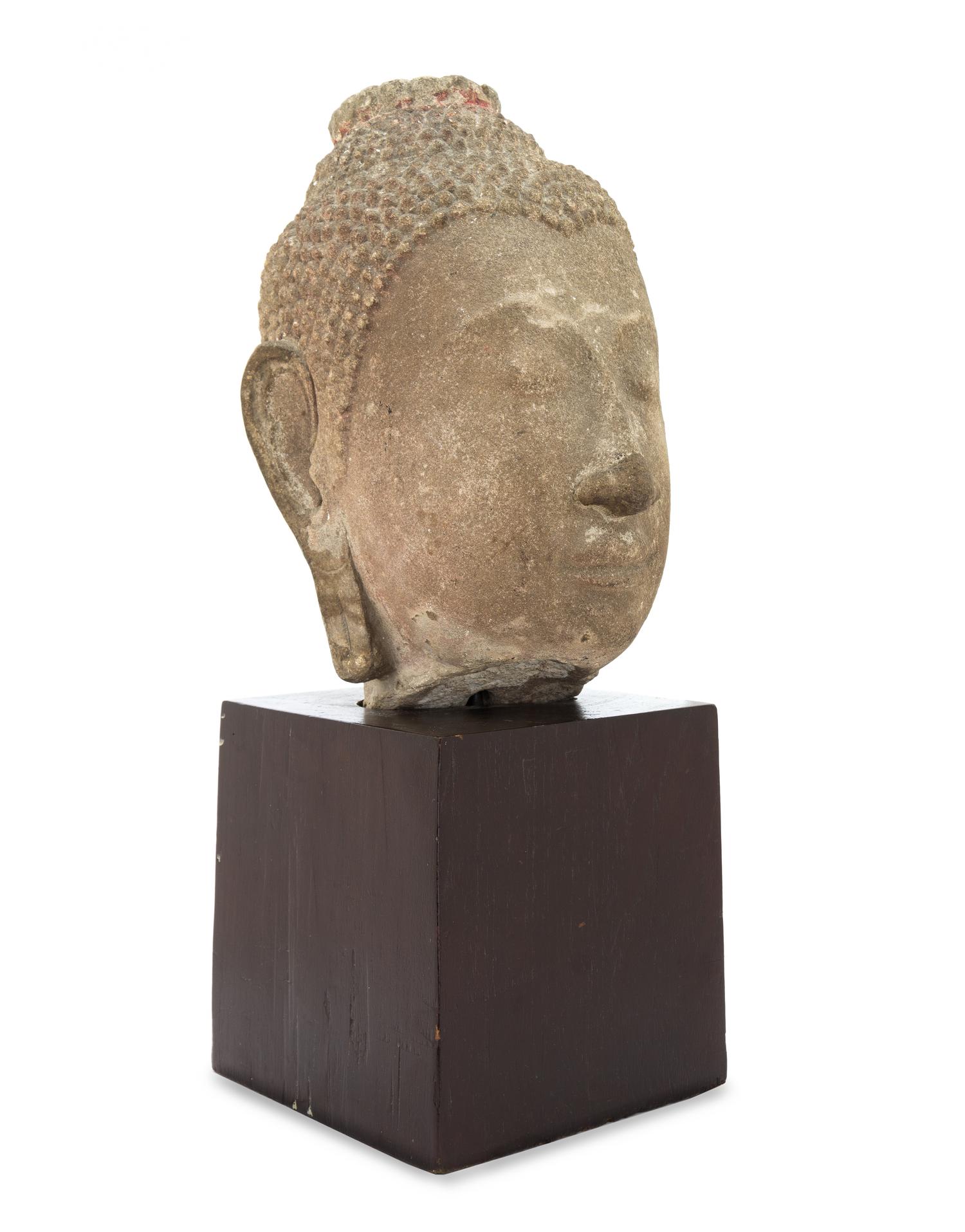 An Early Carved Stone Buddha Head 15TH/16TH CENTURY Height of head 14 1/4 inches. — 15TH/16TH CENTURY
