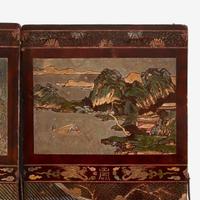 A Chinese carved twelve-panel "Coromandel" folding screen 17th/18th Century