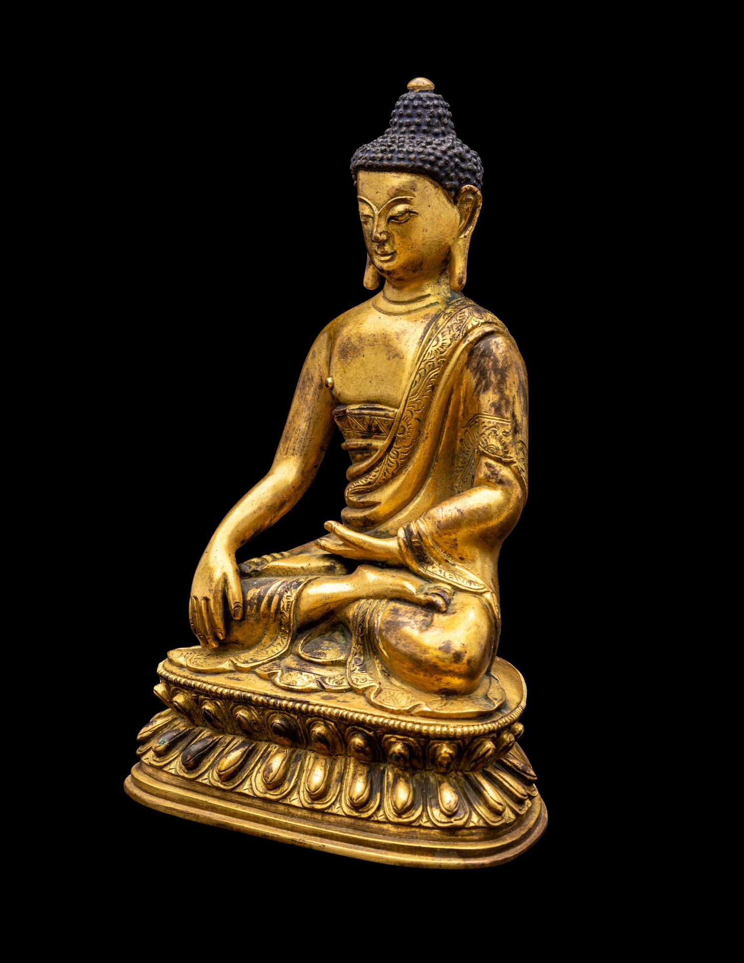 A Sino-Tibetan Gilt Bronze Figure of Seated Buddha