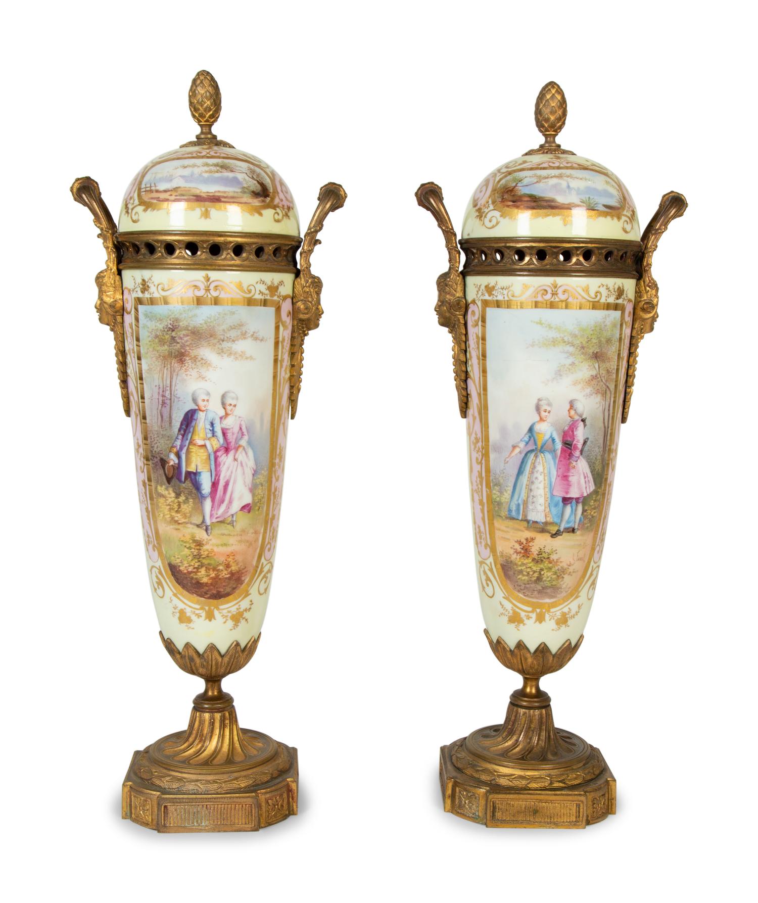 A Pair of Gilt Bronze Mounted Sèvres Style Porcelain Urns