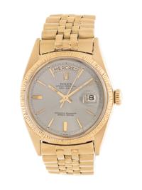 ROLEX, REF. 1807 18K YELLOW GOLD 'OYSTER-PERPETUAL FRENCH DAY DATE' WRISTWATCH, CIRCA 1969