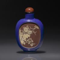 A Chinese Enameled Yixing Stoneware Snuff Bottle, Qing Dynasty, Circa 1820-1860 — 1820-1860年 宜興紫砂藍釉開光山水花卉紋鼻煙壺