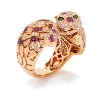An 18 Karat Rose Gold, Diamond, Ruby and Tsavorite Garnet Panther Motif Ring, 8.75 dwts.