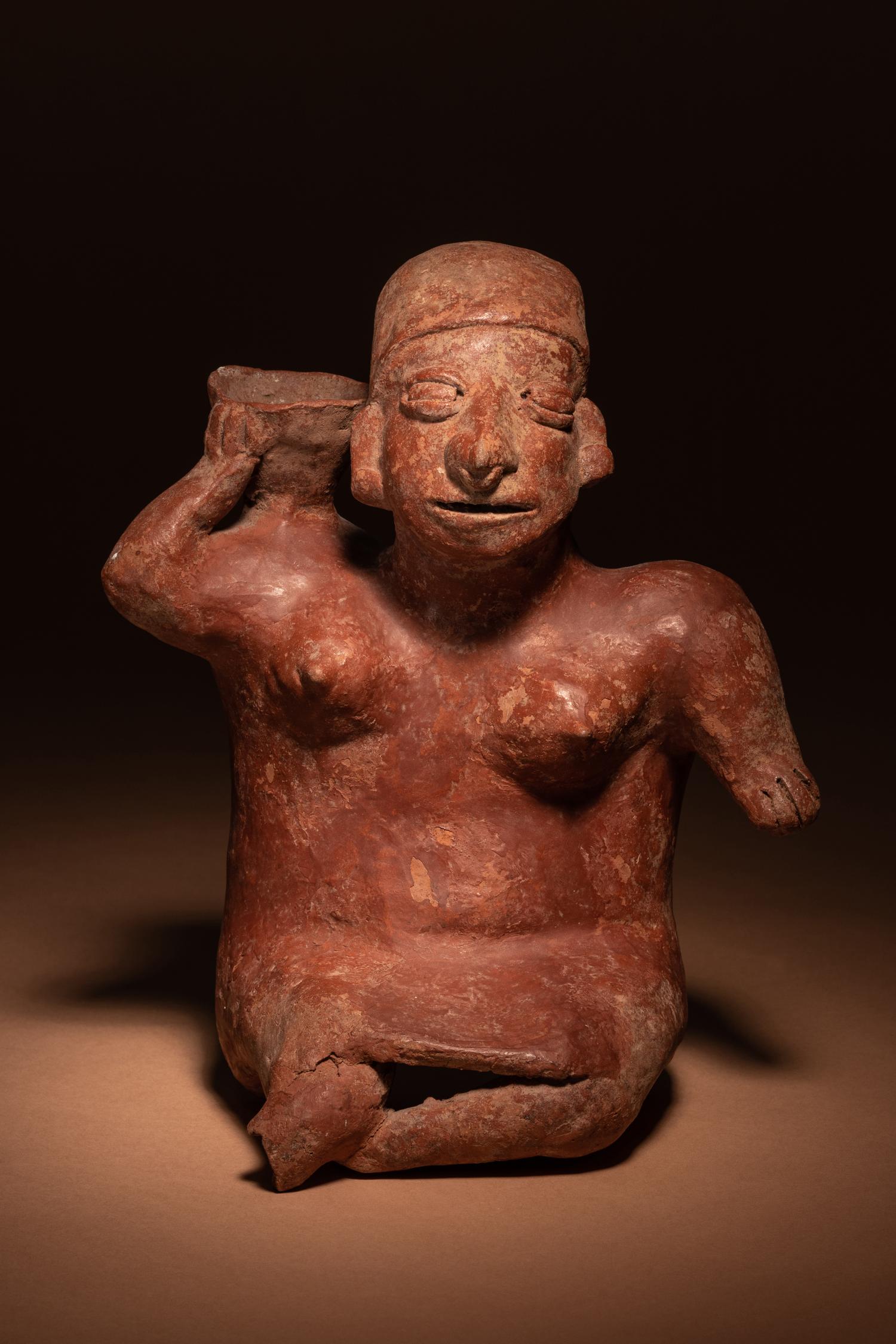 A Colima Terracotta Female with Basket Figure