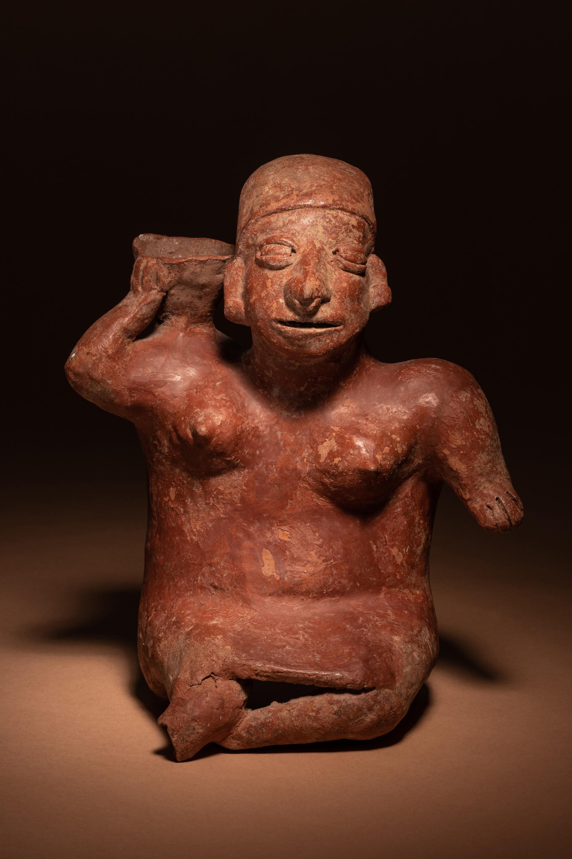 A Colima Terracotta Female with Basket Figure