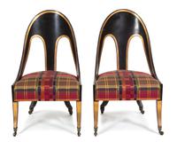A Pair of Italian Neoclassical Ebonized and Parcel Gilt Decorated Spoon Chairs Height 38 inches. — 20TH CENTURY