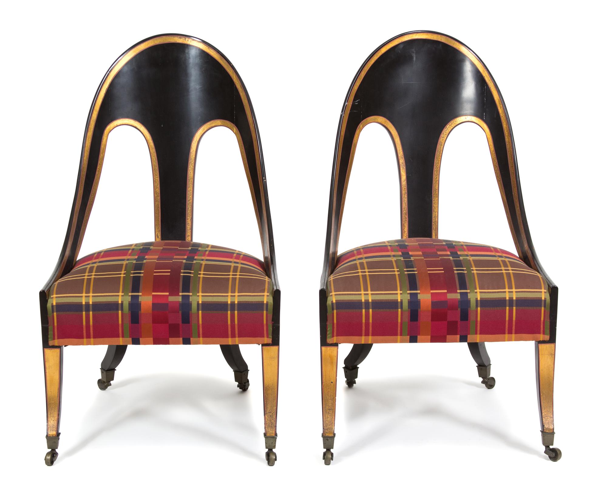 A Pair of Italian Neoclassical Ebonized and Parcel Gilt Decorated Spoon Chairs Height 38 inches. — 20TH CENTURY