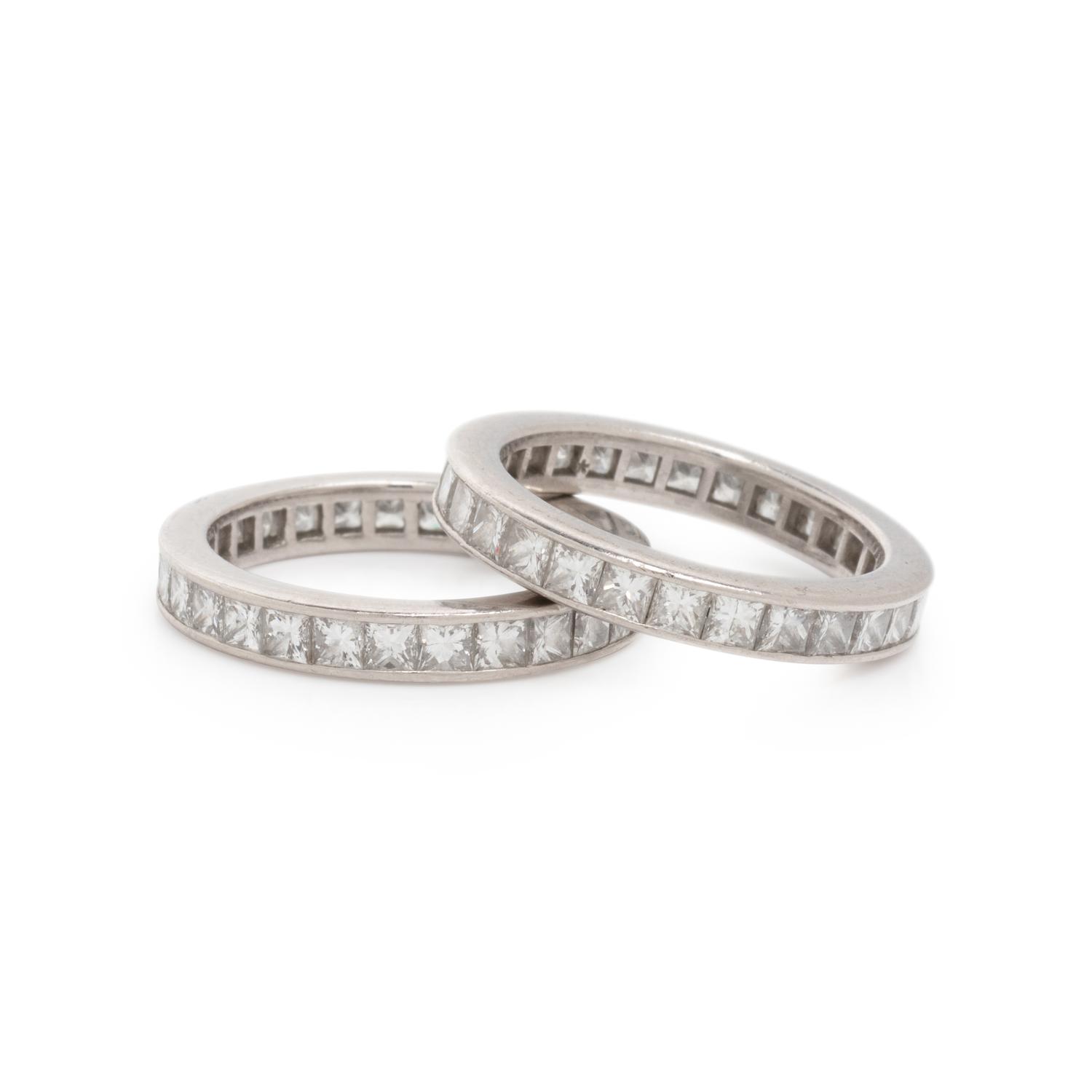 TIFFANY & CO., PAIR OF DIAMOND AND PLATINUM ETERNITY BANDS
