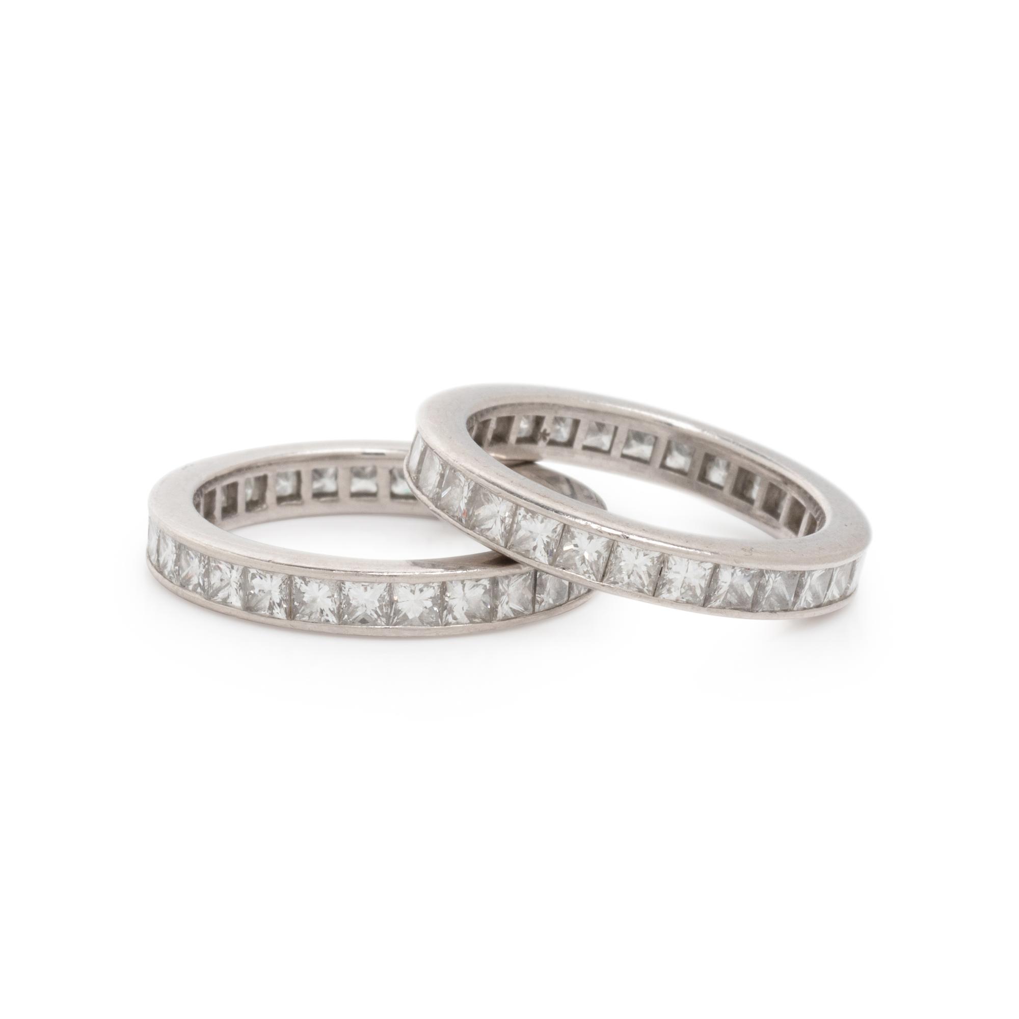 TIFFANY & CO., PAIR OF DIAMOND AND PLATINUM ETERNITY BANDS