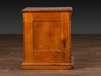 A Six-Drawer Oak Spool Cabinet
