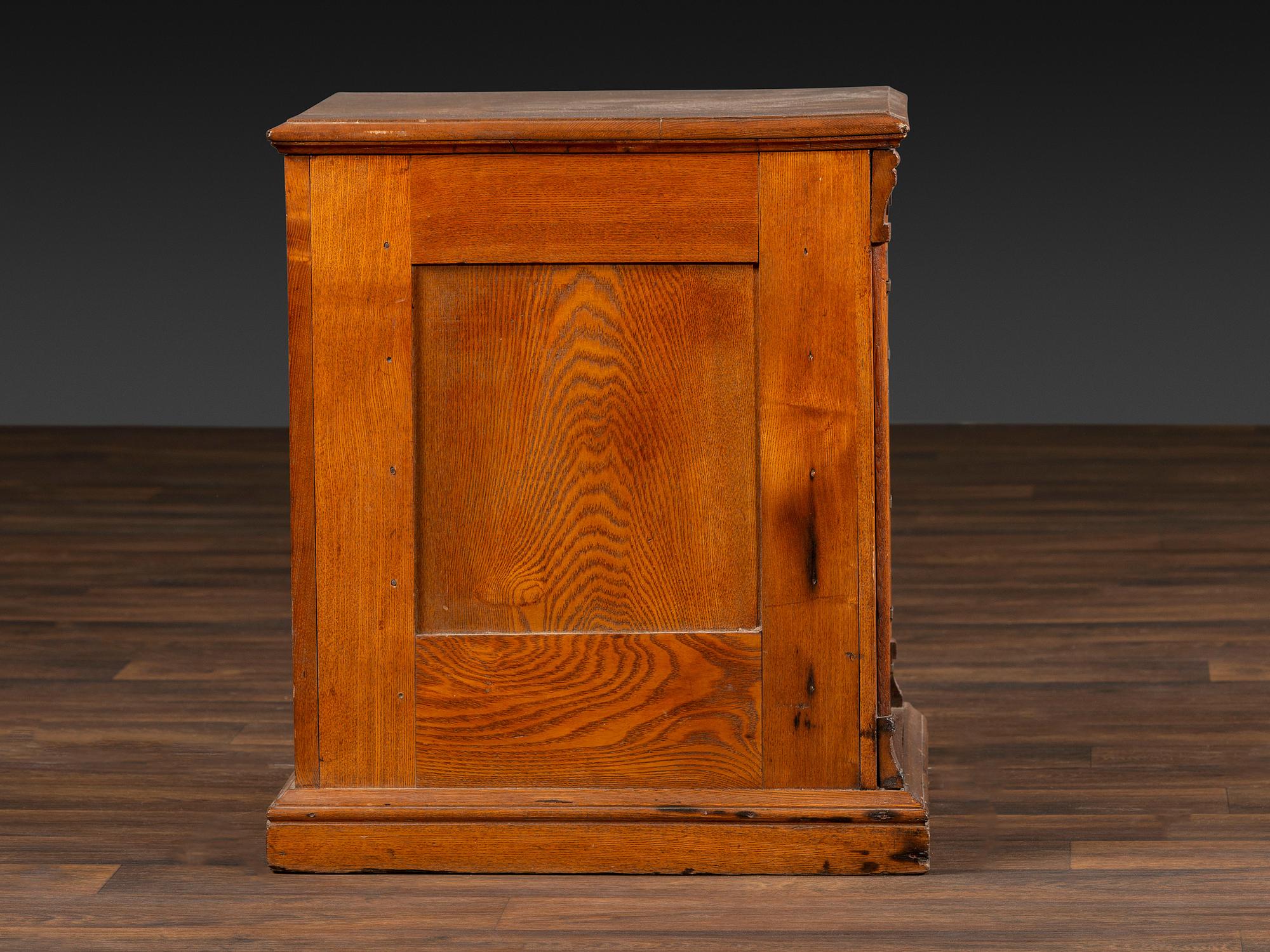 A Six-Drawer Oak Spool Cabinet