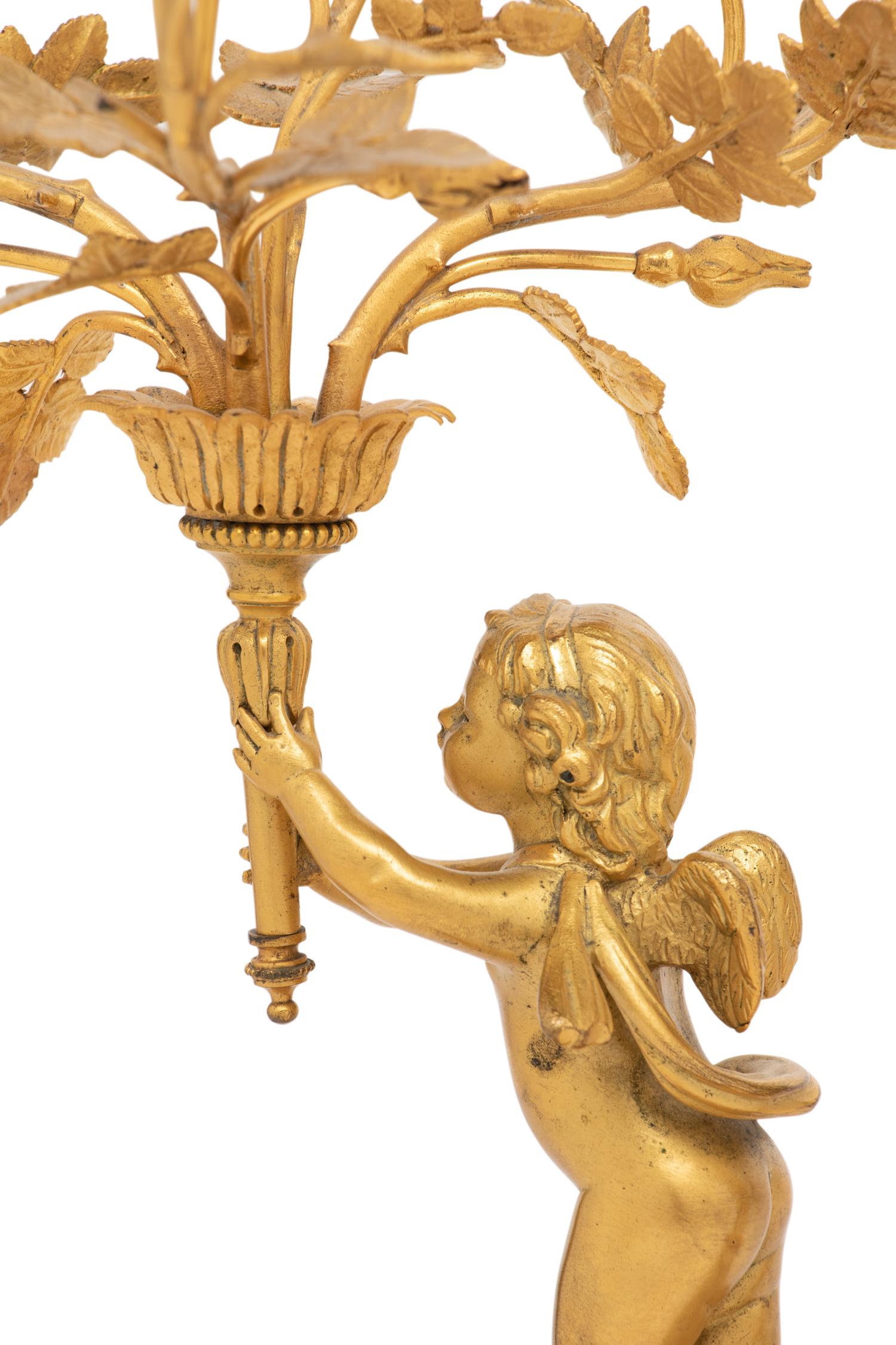 A Pair of Louis XV Style Gilt Bronze and Marble Three-Light Candelabra