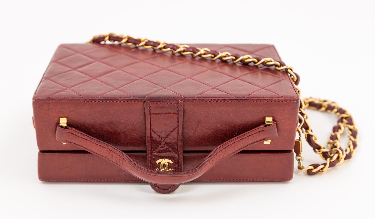 A Chanel Burgundy Lambskin Quilted Box Bag, 7.5" x 5.25" x 2.5"; Strap drop: 18".