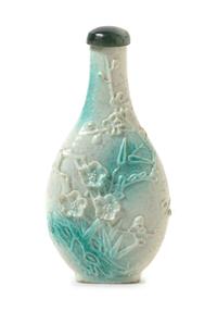 A Green Glazed Porcelain Snuff Bottle Height 3 1/4 inches.