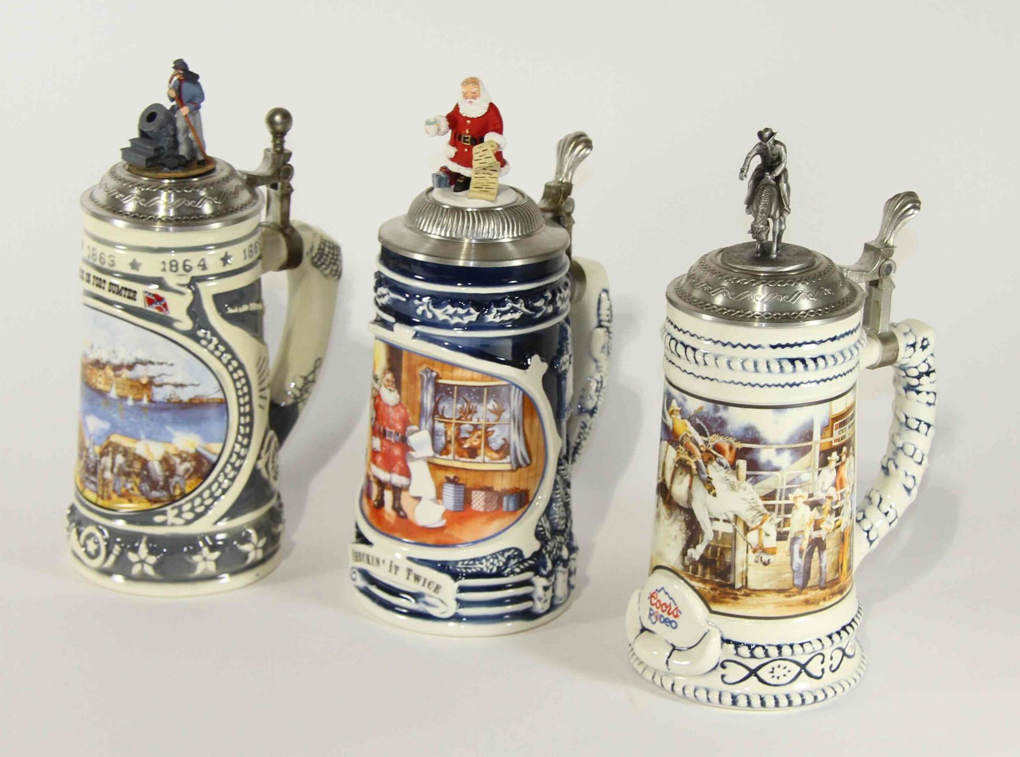 A Group of Three Commemorative Steins Height of tallest 10 inches.