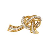McTEIGUE & CO., YELLOW GOLD, PLATINUM AND DIAMOND RIBBON BROOCH
