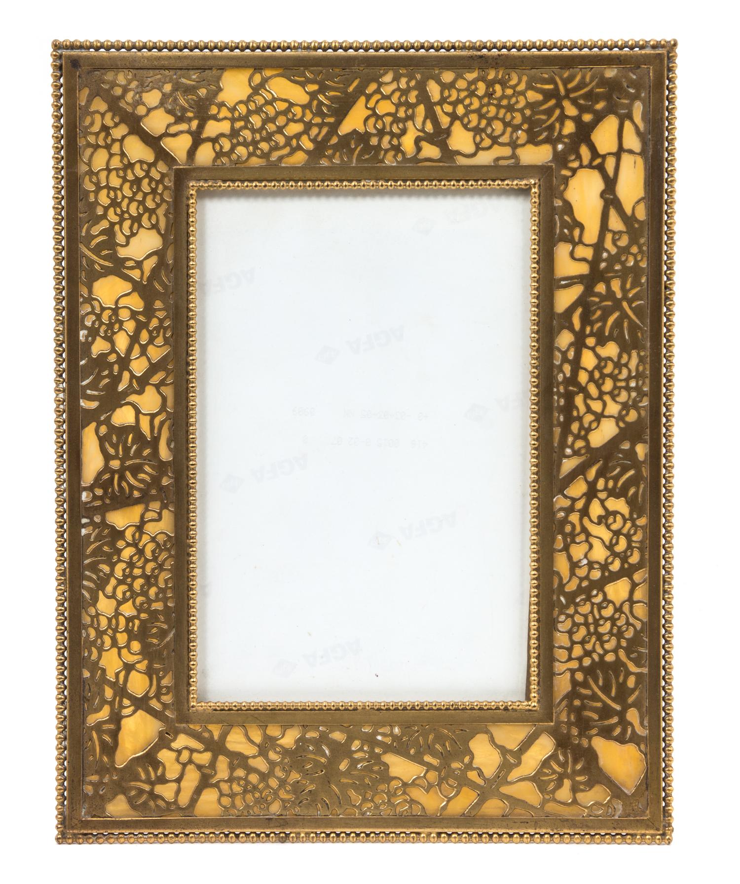 A Tiffany Studios Gilt Bronze Picture Frame 11 5/8 x 8 7/8 inches. — 20TH CENTURY