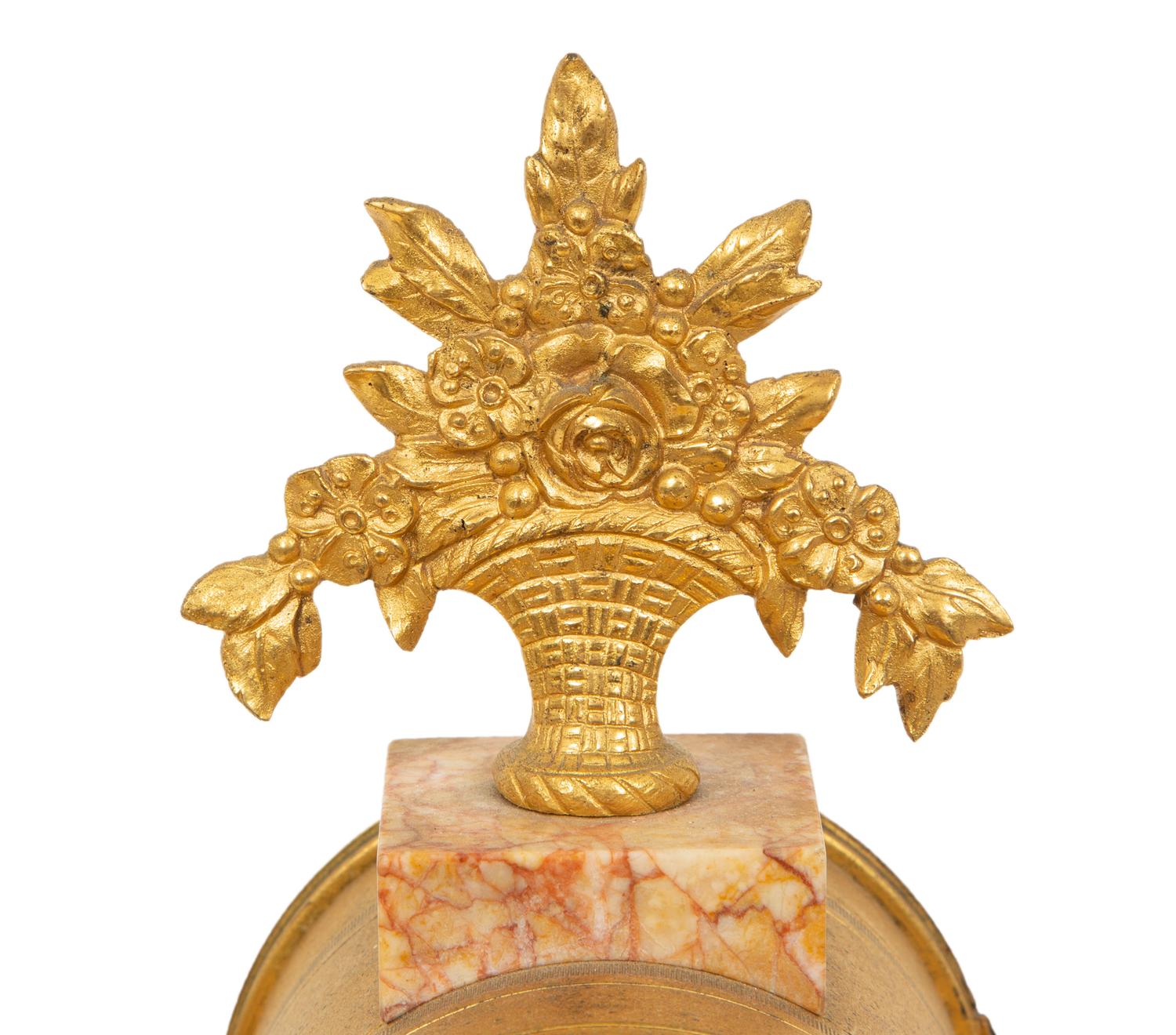 A French Gilt Bronze and Rouge Marble Clock Garniture