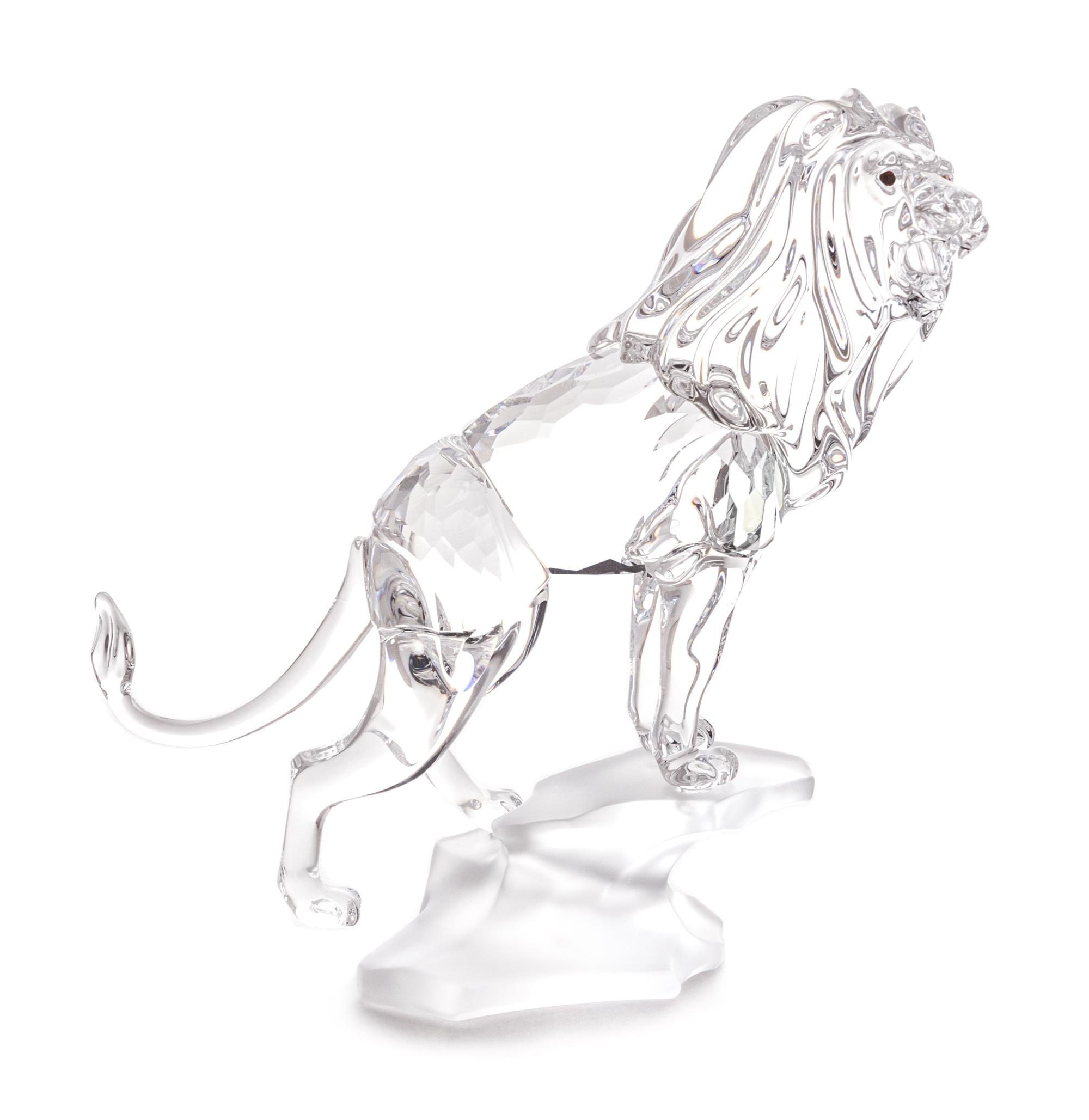 A Swarovski Model of a Lion Height 4 3/4 inches.