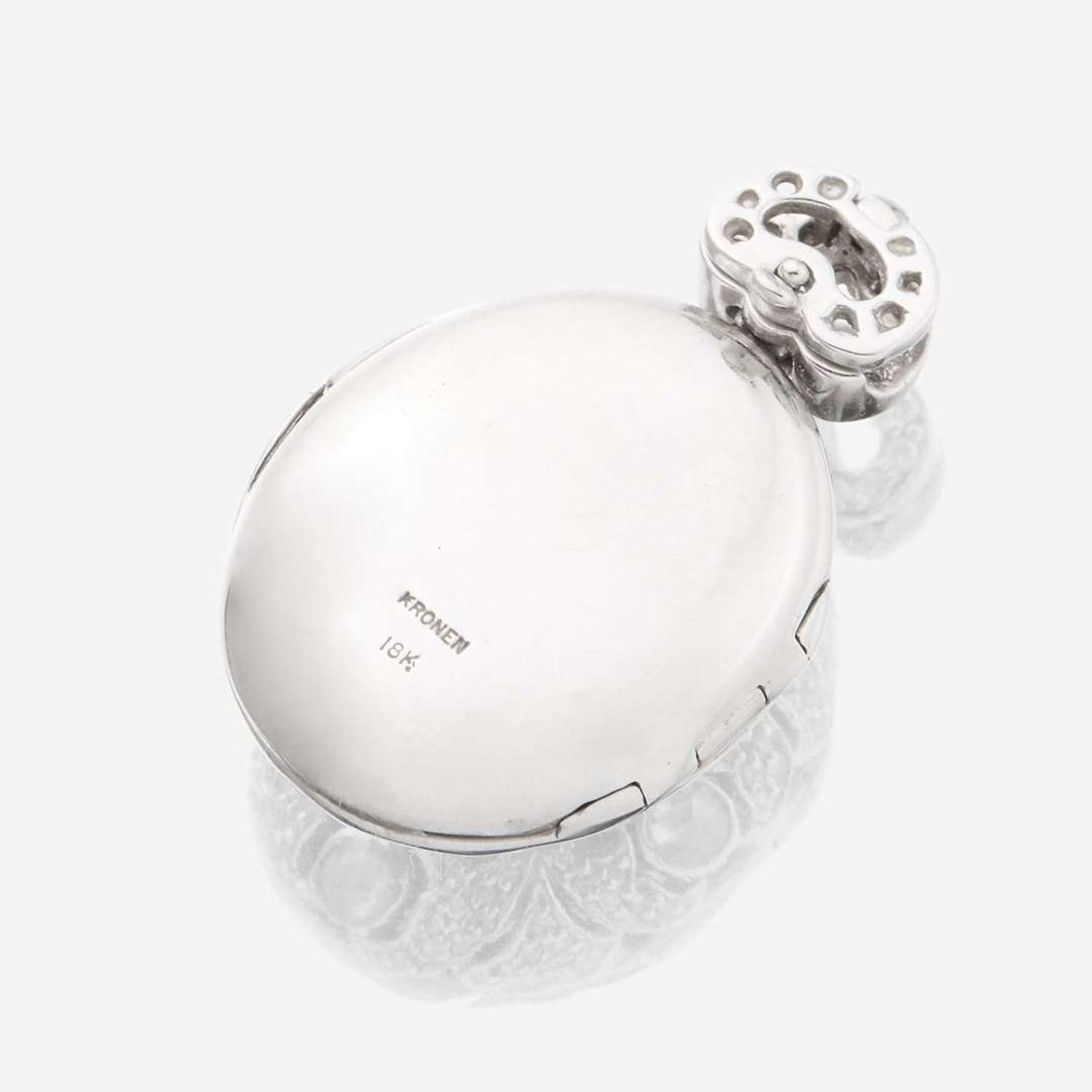 An eighteen karat white gold and diamond pendant locket