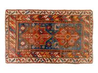 A Kuba Wool Rug and a Kuba Wool Mat