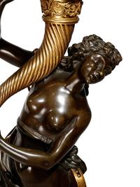 A Pair of Large Gilt and Patinated Bronze Figural Nine-Light Candelabra after the Models by Clodion