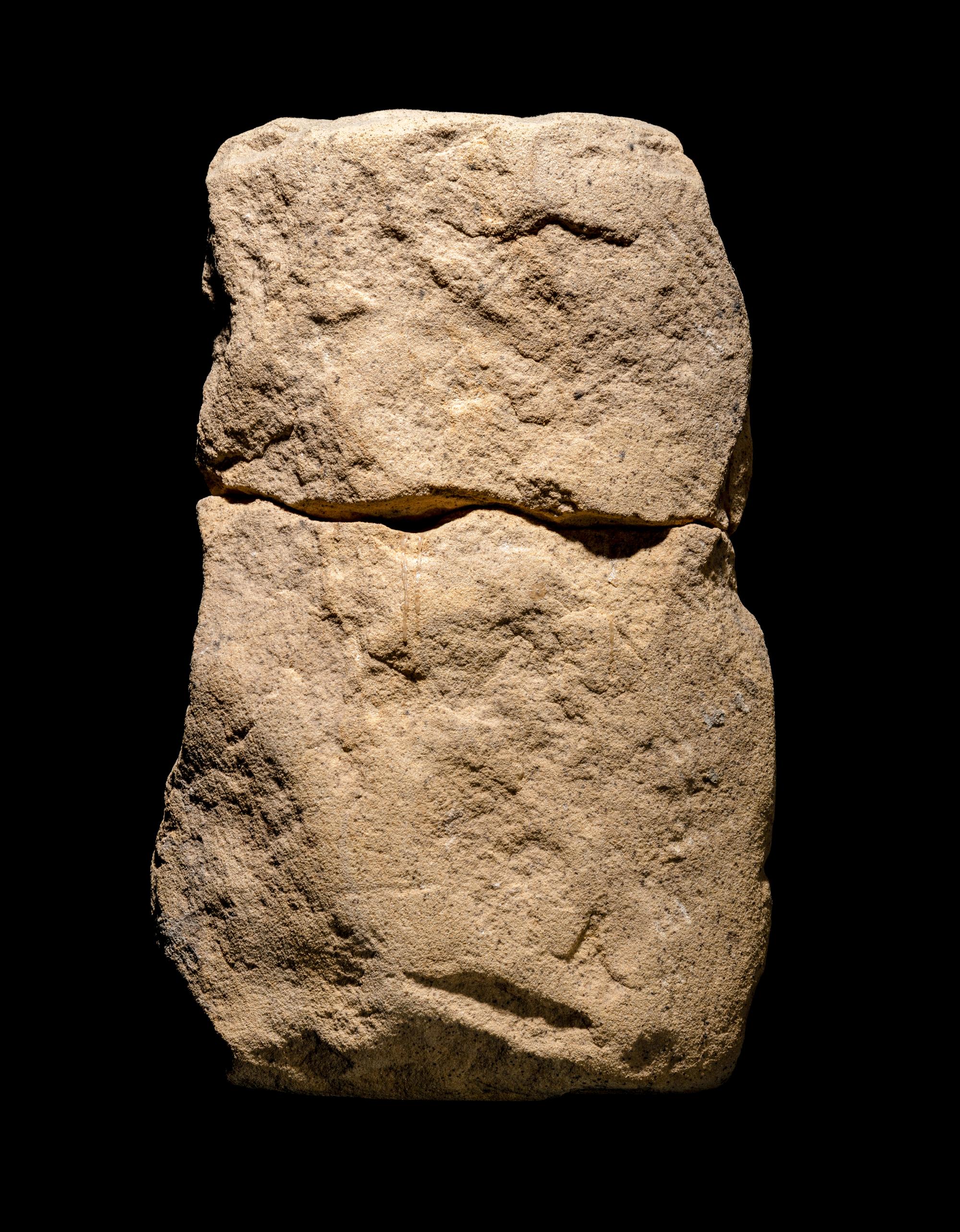 An Egyptian Sandstone Fragment with Osiris and Isis