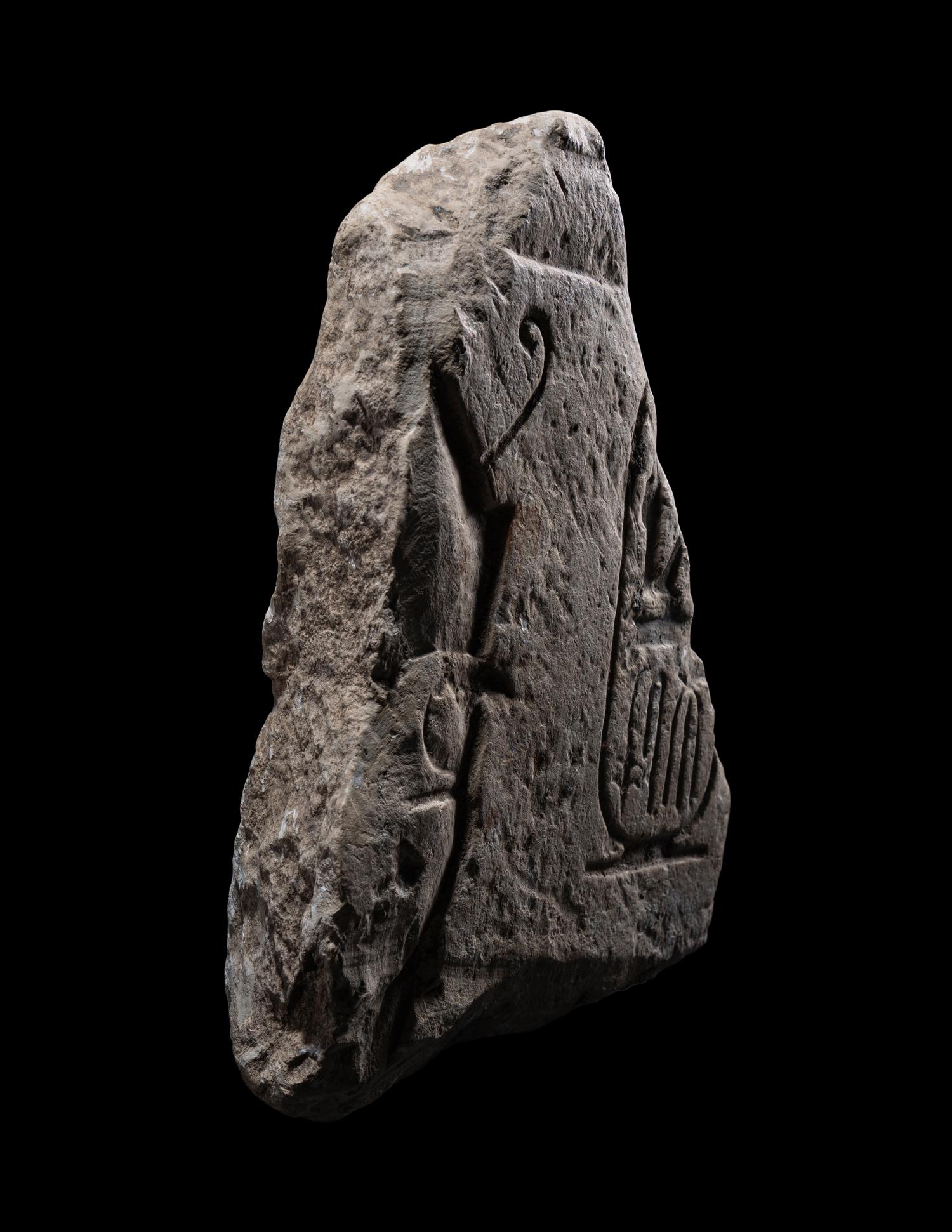 An Egyptian Limestone Relief Fragment with Cartouche of Ramesses II