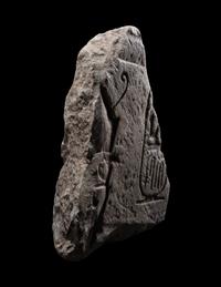 An Egyptian Limestone Relief Fragment with Cartouche of Ramesses II