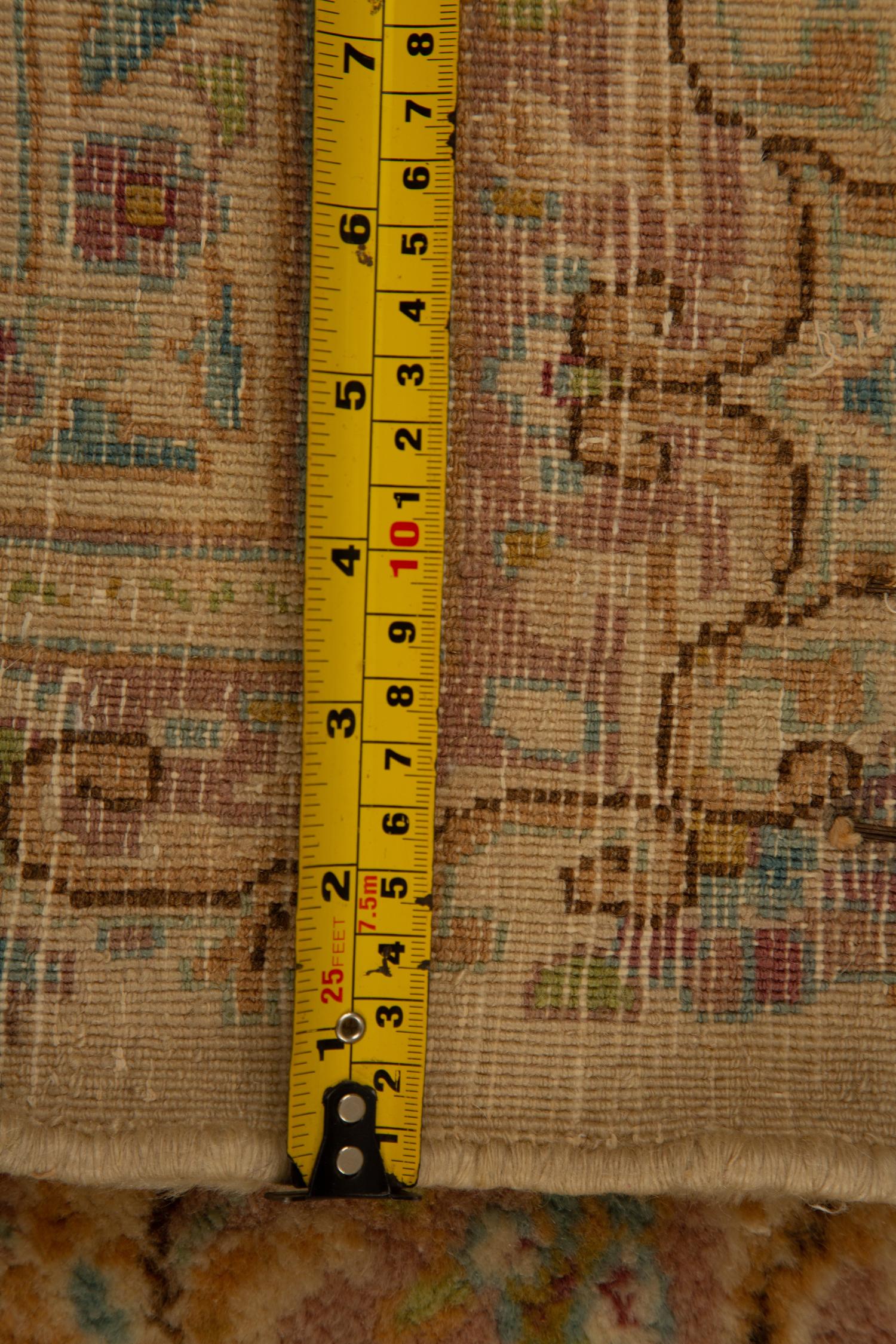 A Kirman Wool Rug — 20th Century