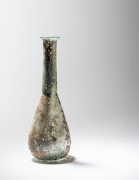 A Roman Pale Blue Glass Unguentarium